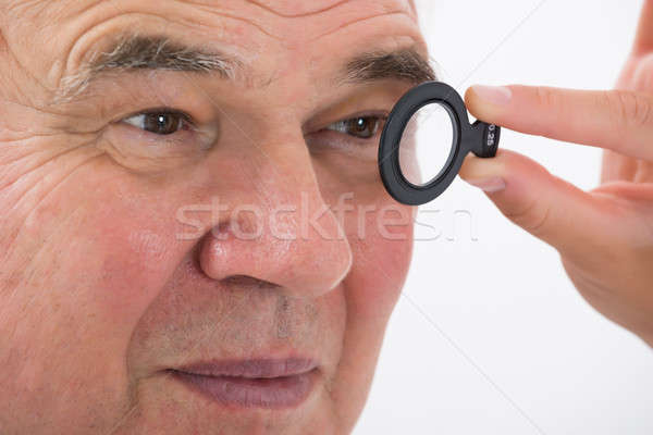An Optometrist Examining Patient's Eyesight With Trial Frame Stock photo © AndreyPopov