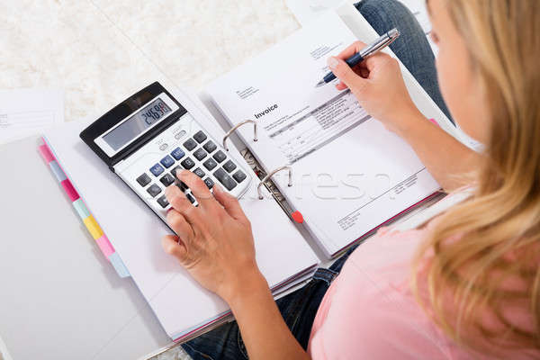 Woman Calculating Budget Stock photo © AndreyPopov