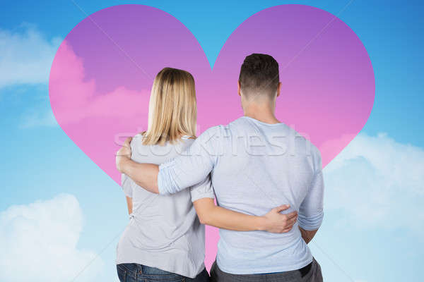 Loving Couple Looking At Heart On Sky Stock photo © AndreyPopov