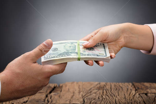 Businessperson Giving Bribe To Partner Stock photo © AndreyPopov