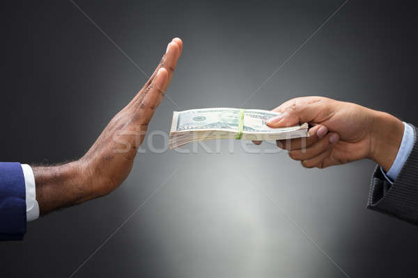Close-up Of A Man's Hand Refusing Bribe Stock photo © AndreyPopov