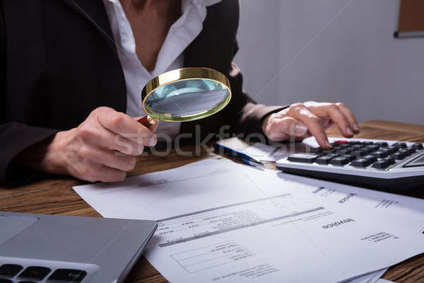 Homme d'affaires facture bureau main loupe affaires [[stock_photo]] © AndreyPopov