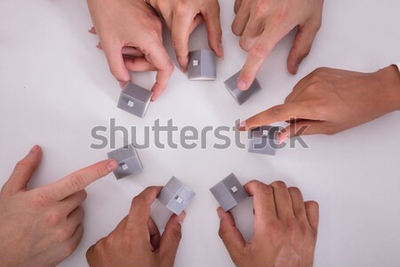 Group Of People Touching Miniature House Stock photo © AndreyPopov