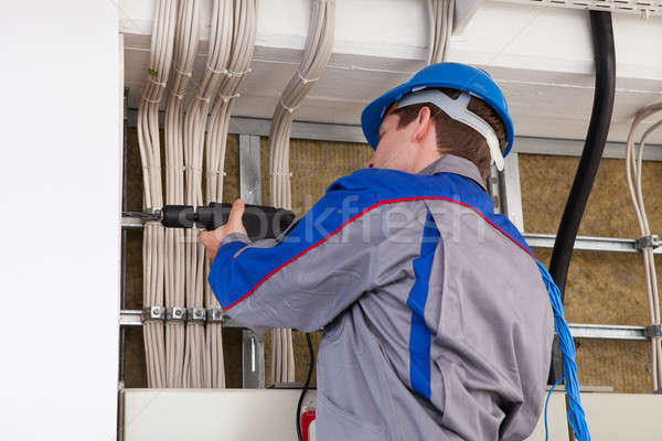 Porträt Bauarbeiter männlich Arbeitnehmer elektrische Bohrer Stock foto © AndreyPopov