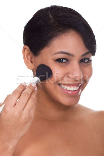 Young Woman Applying Blush Stock photo © AndreyPopov