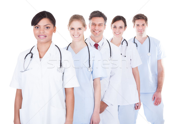 Foto stock: Médicos · pie · feliz · grupo