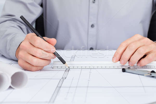 Architect Drawing On Blueprint Stock photo © AndreyPopov
