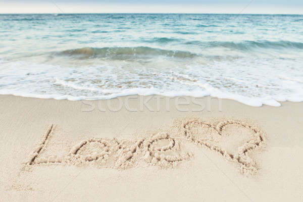 Love Text And Heart Drawn On Sand By Sea Stock photo © AndreyPopov