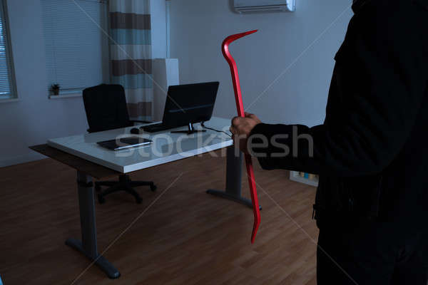 Burglar With Crowbar In Office Stock photo © AndreyPopov
