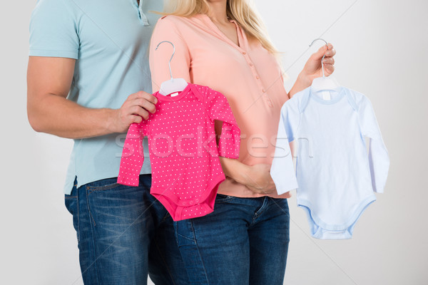 Midsection Of Couple Holding Baby Clothing Stock photo © AndreyPopov
