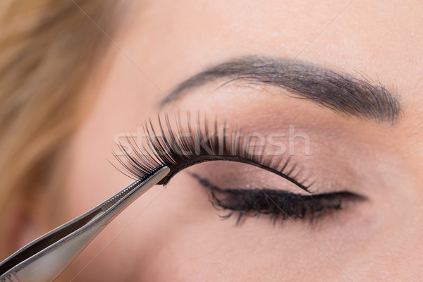 False Eyelashes Being Put On Woman's Eye Stock photo © AndreyPopov