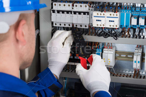 Male Electrician Repairing Fusebox Stock photo © AndreyPopov