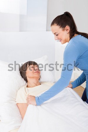 Woman Showing Red Card To Man In Bed Stock photo © AndreyPopov