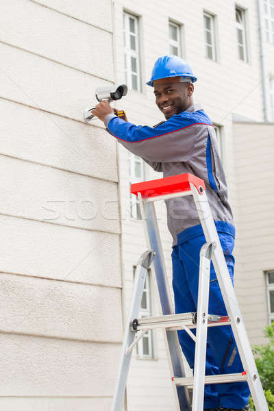 Technician Repairing Surveillance Camera Stock photo © AndreyPopov