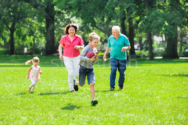 Grandparent And Grandchildren Playing Rugby In The Park Stock photo © AndreyPopov
