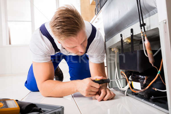 Stock photo: Male Technician Checking Refrigerator