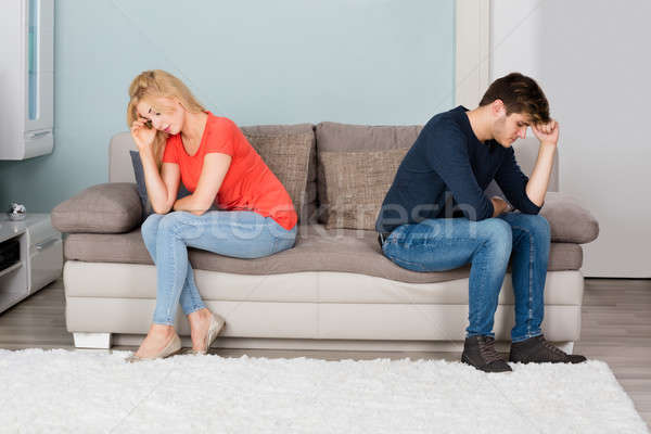 Sad Couple Sitting Back To Back On Sofa Stock photo © AndreyPopov