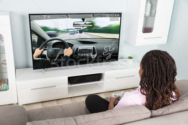 Girl Playing Video Racing Car Game Stock photo © AndreyPopov