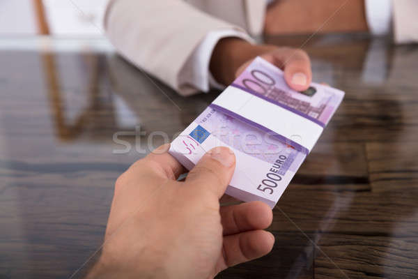Businesswoman And Man Exchanging Money Stock photo © AndreyPopov