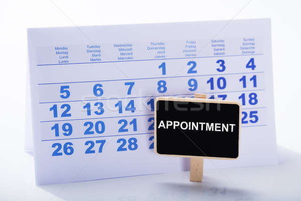 Miniature Appointment Placard In Front Of Calendar Stock photo © AndreyPopov