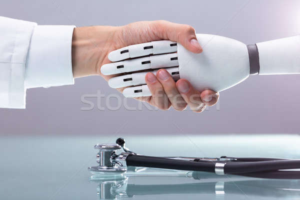 врач робота рукопожатием стетоскоп бизнеса человека Сток-фото © AndreyPopov