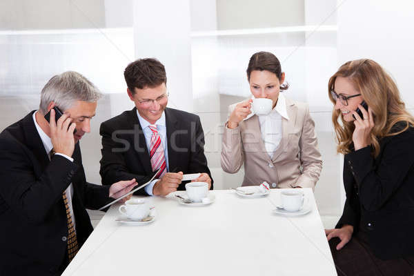 Business executives enjoying coffee Stock photo © AndreyPopov