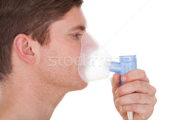 Young Man Wearing Oxygen Mask Stock photo © AndreyPopov
