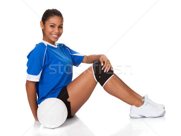 Feliz jovem sessão voleibol isolado branco Foto stock © AndreyPopov