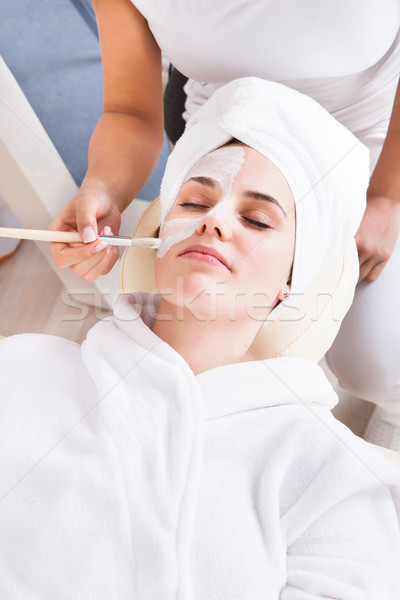 Therapist Applying Face Mask To Woman Stock photo © AndreyPopov