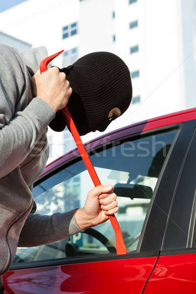 Thief In Hooded Jacket And Balaclava Opening Car's Door Stock photo © AndreyPopov