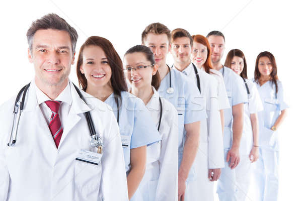 Long line of smiling doctors and nurses Stock photo © AndreyPopov