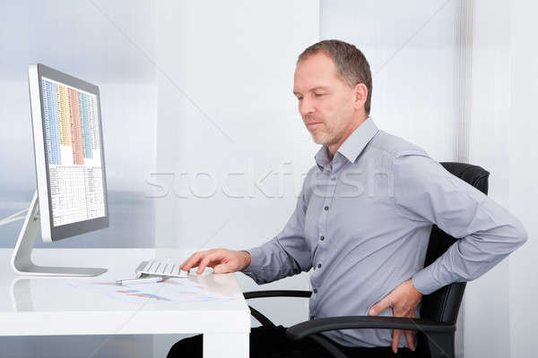 Businessman Suffering From Back Pain Stock photo © AndreyPopov
