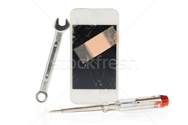 Cellphone With Spanner And Electric Tester Stock photo © AndreyPopov
