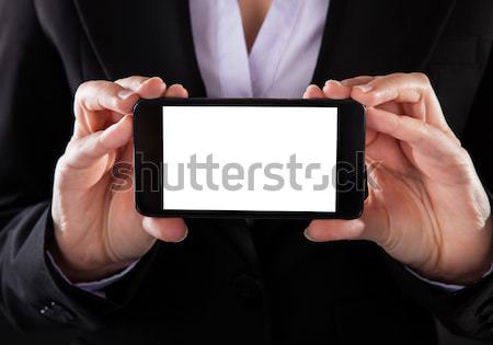 Businessperson Showing Mobile Phone Stock photo © AndreyPopov