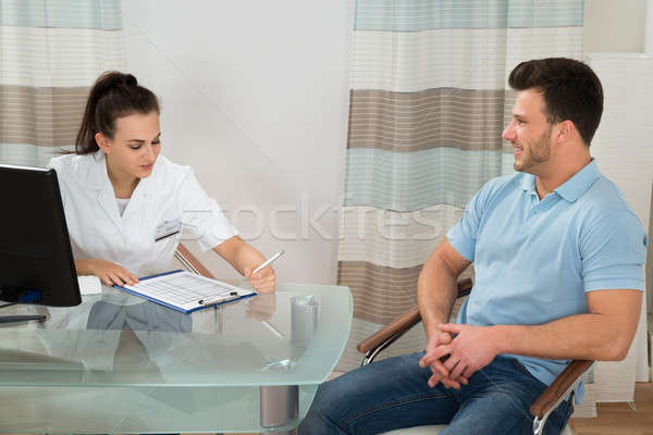 Doctor Advising Male Patient Stock photo © AndreyPopov