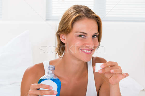 Woman Holding Bottle Of Mouthwash Stock photo © AndreyPopov