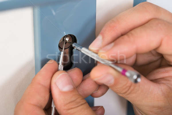 Lockpicker Fixing Door Handle At Home Stock photo © AndreyPopov