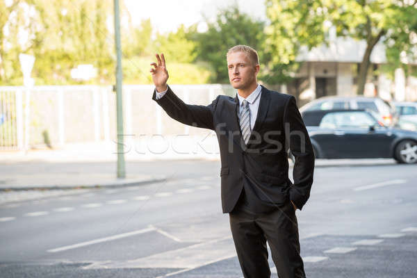 Zakenman roepen taxi jonge straat weg Stockfoto © AndreyPopov