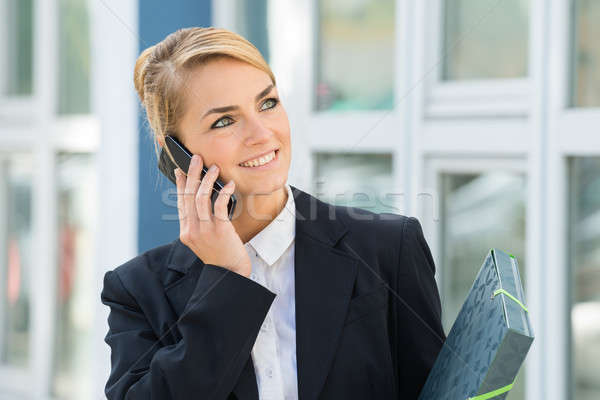 Businesswoman Using Mobile Phone Stock photo © AndreyPopov