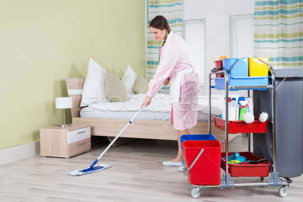 Female Housekeeper Mopping Floor Stock photo © AndreyPopov