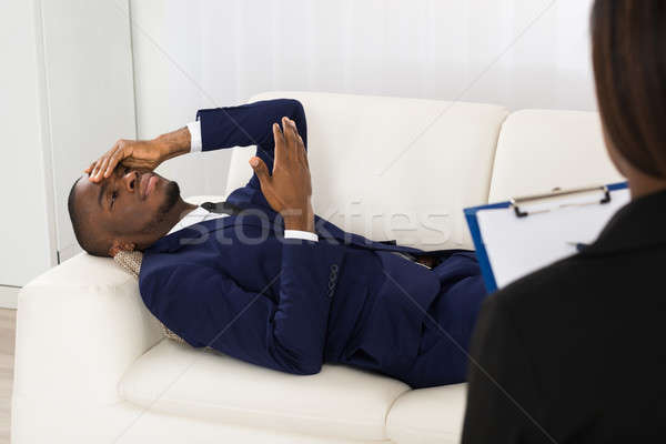 Beteg fektet kanapé pszichiáter afroamerikai férfi Stock fotó © AndreyPopov