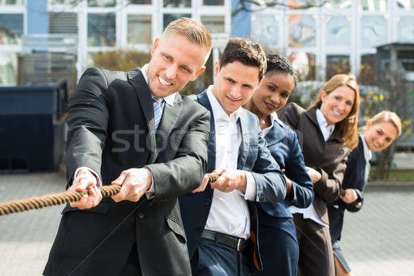 Multiethnic Businesspeople Playing Tug Of War Stock photo © AndreyPopov