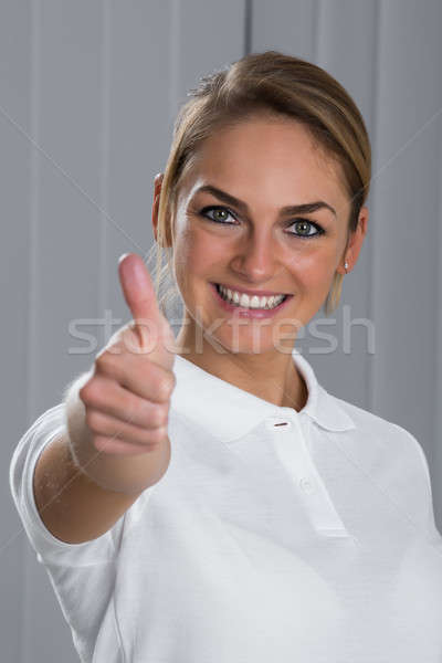 Woman Showing Thumbs Up Sign Stock photo © AndreyPopov