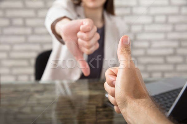 Two Hands Signaling Thumbs Up And Thumbs Down Stock photo © AndreyPopov