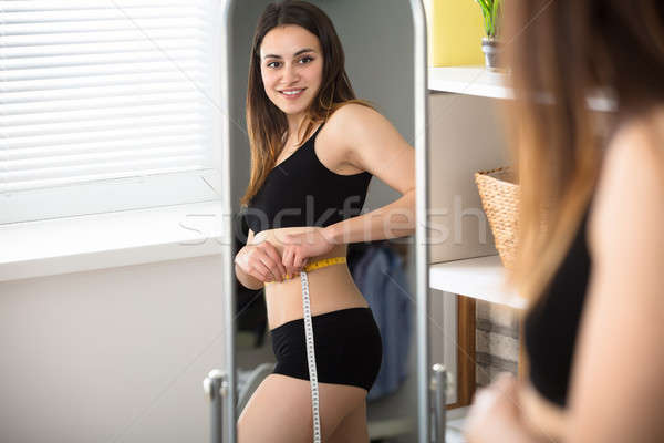 Imagine de stoc: Femeie · burtă · oglindă · fitness · tineri