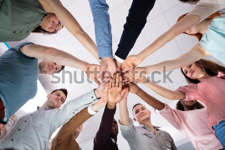 Businesspeople Stacking Their Hands Stock photo © AndreyPopov