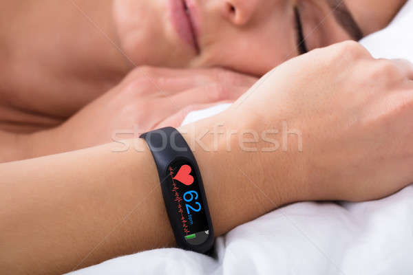 Stock photo: Fitness Activity Tracker With Heartbeat Rate On Woman's Hand