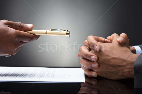 Person Offering Pen To The Other Person With Clasped Hand Stock photo © AndreyPopov
