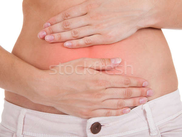 Close up of woman's hands on belly Stock photo © AndreyPopov