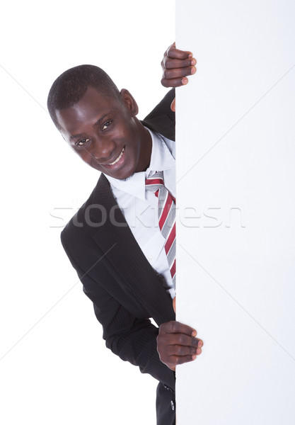 African Businessman Holding Placard Stock photo © AndreyPopov